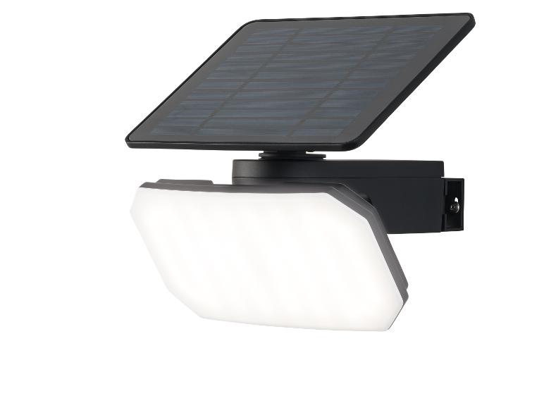 Projecteur solaire LED noir avec panneau solaire intégré.