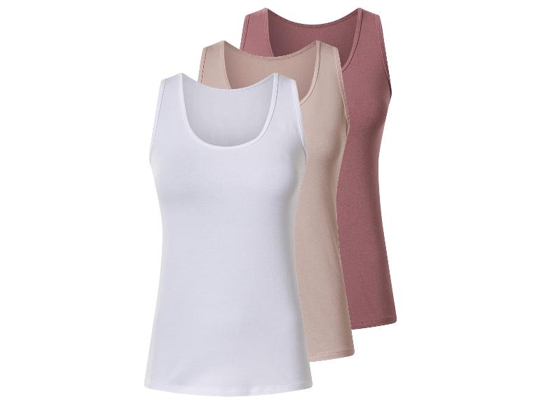Trois débardeurs pour femmes en blanc, beige et rose.