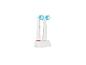 Deux têtes de brosse à dents électriques avec des poils bleus et verts dans un support blanc.