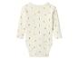 Body bébé à manches longues crème avec un motif de petits canards jaunes.