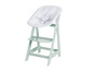 Une chaise haute en bois vert avec un siège blanc matelassé.