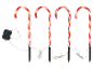 Quatre lumières de chemin en forme de canne à sucre illuminées avec des rayures rouges et blanches, connectées à un boîtier de commande.