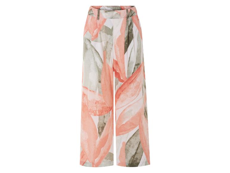 Pantalon large à motif floral, tons corail et vert.