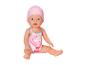 Poupée bébé en maillot de bain rose flamant rose et bonnet de bain rose.