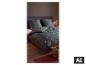 Parure de lit en satin de microfibre LIVARNO home avec motif de Noël sur un lit. [image générée par l'IA]