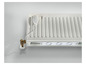 Un radiateur blanc avec un thermostat intelligent et un système de ventilation