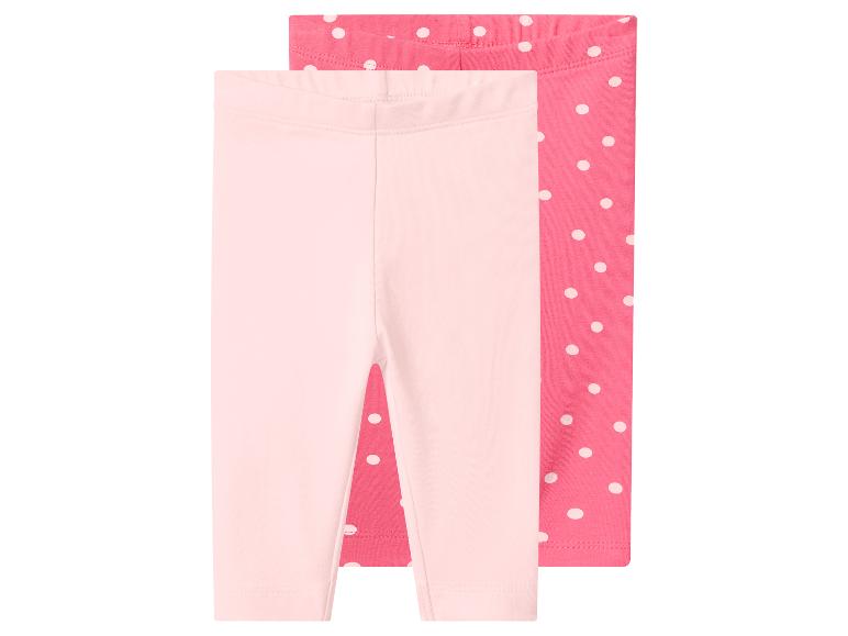 2 paires de leggings bébé : un rose clair et un rose à pois blancs.