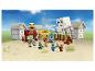 Ensemble LEGO Minecraft avec un village, des personnages et un Ghast volant.