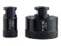 Deux trépans diamantés noirs de 30 mm et 68 mm pour le perçage.