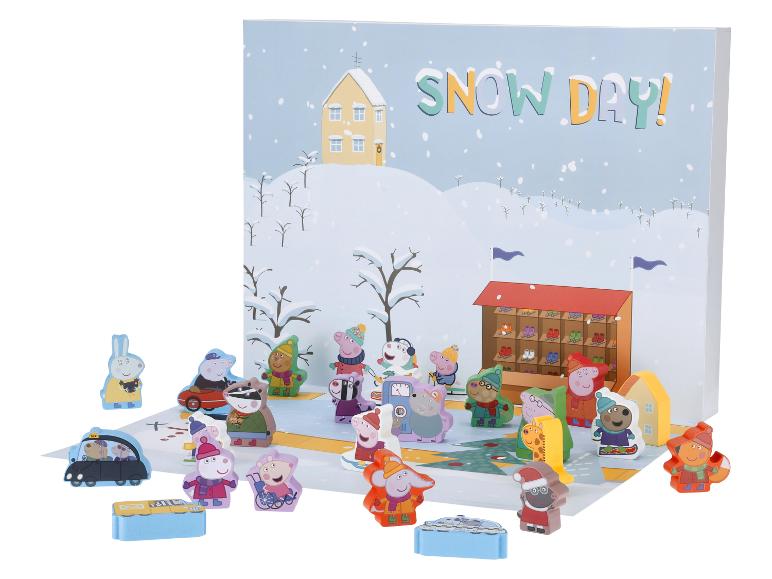Un ensemble de jeu Peppa Pig sur le thème de l'hiver avec des figurines et un décor de jour de neige.