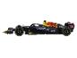 Une voiture de course de Formule 1 noire avec les logos Red Bull, Oracle et Mobil 1.