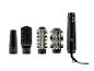 Styler capillaire avec quatre accessoires interchangeables : un concentrateur, une brosse et deux brosses rondes.