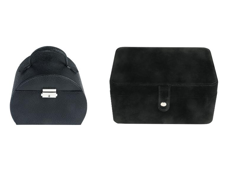 Deux boîtes à bijoux noires, une ronde avec une poignée et une rectangulaire avec une fermeture.