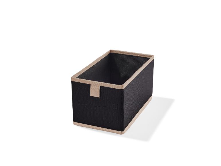 Une boîte de rangement noire avec un bord beige.