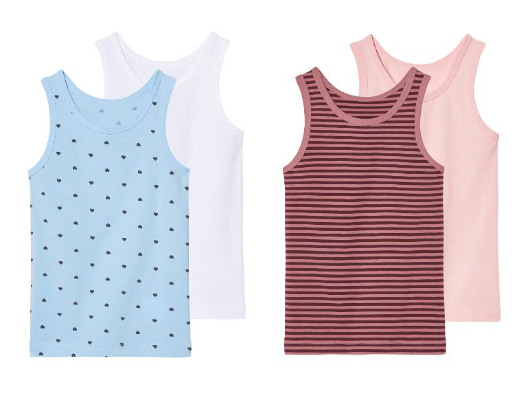Débardeurs pour enfants avec motifs cœurs et rayures.