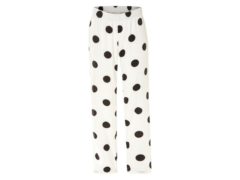 Pantalon de pyjama blanc à pois noirs.