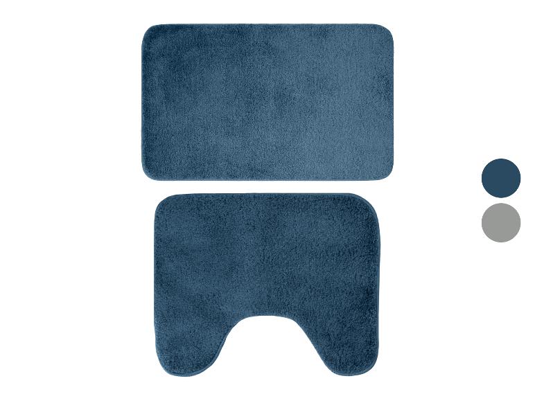 Ensemble de tapis de bain bleus avec un tapis rectangulaire et un en forme de U.