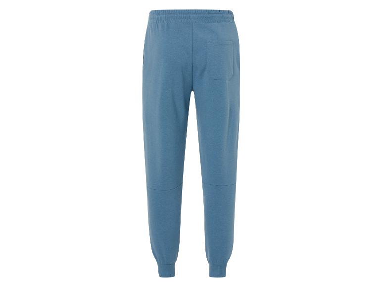 Pantalon de survêtement bleu avec une taille élastique.