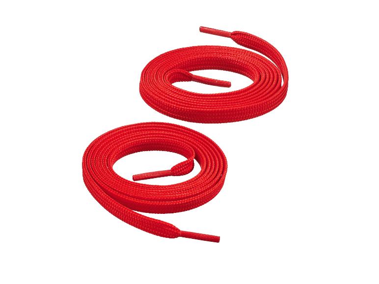 Deux lacets rouges enroulés en cercles sur un fond blanc.