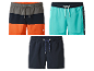 Trois maillots de bain U.S. Grand Polo de différentes couleurs.
