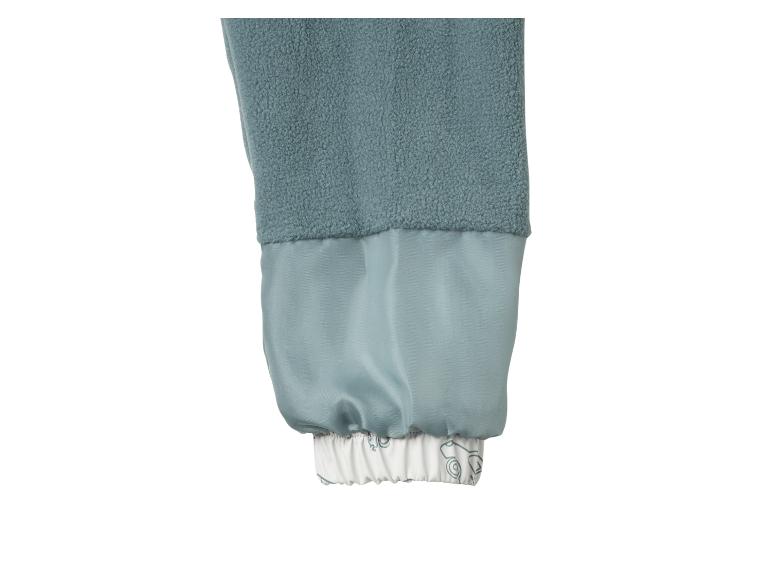 Veste polaire bleue avec garniture en satin et manchette imprimée