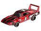 Une Dodge Charger Daytona Hot Wheels rouge avec des pneus blancs.