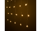 Guirlande lumineuse LED en forme d'étoiles blanc chaud sur fond sombre.