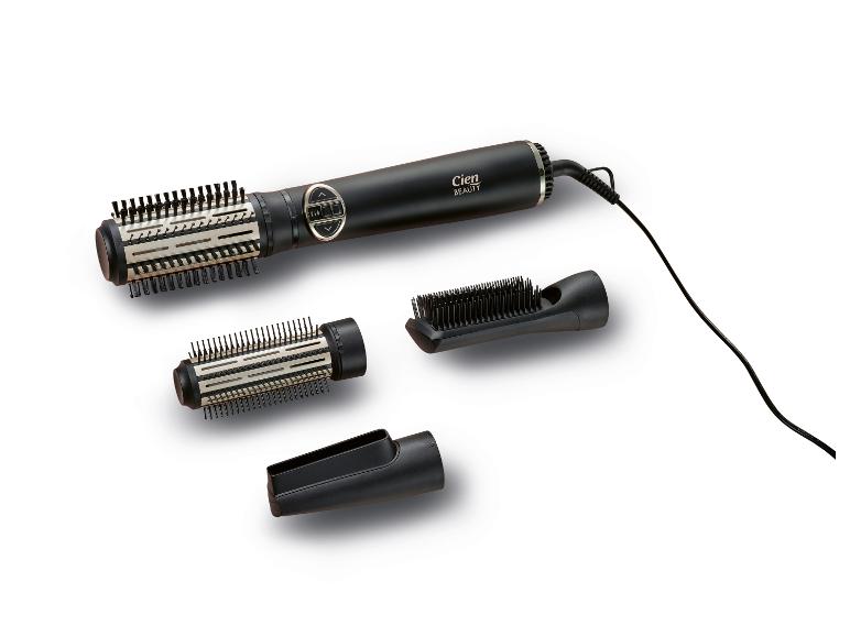 Brosse soufflante rotative noire avec deux têtes de brosse et un embout de coiffage.