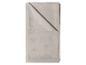 Nappe beige pliée avec motif géométrique.