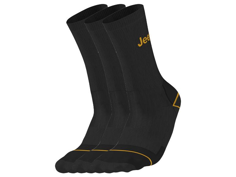 Trois chaussettes noires avec un logo jaune 'Jeep' et des accents jaunes.