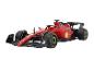Une voiture de course de Formule 1 rouge avec le logo de Santander et Shell.