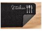 Tapis de cuisine noir avec motif de couverts.