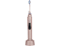 Brosse à dents électrique rose avec base de chargement, avec poils bleus et blancs.
