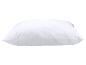 Oreiller blanc matelassé avec un motif ondulé.