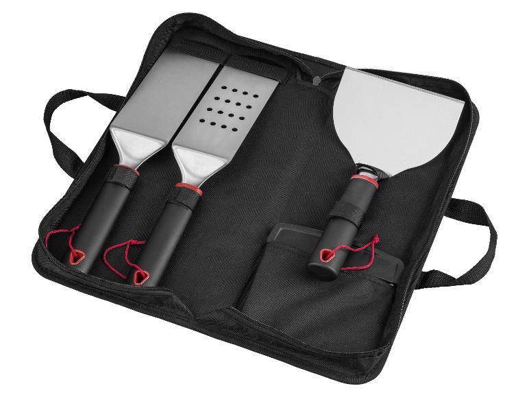 Ensemble de trois spatules de barbecue dans une pochette noire zippée.
