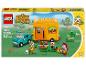 Ensemble LEGO Animal Crossing La Caravane et la Boutique de Jardin de Leif avec un camion sarcelle et un camping-car jaune.