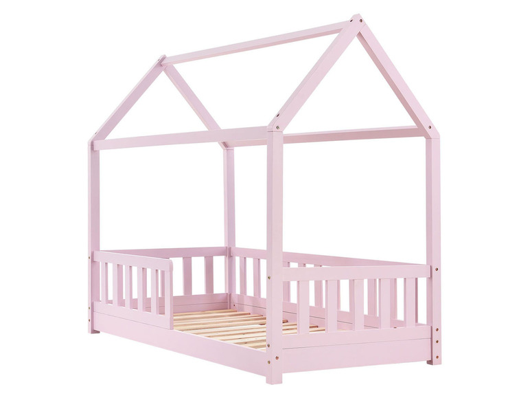 Un lit en bois rose avec un dais en forme de maison.