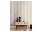 Table console en bois avec un vase noir, un buste et des objets décoratifs devant un mur rayé.