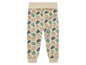 Pantalon beige à imprimé d'éléphants pour bébé.
