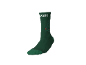 Chaussette verte avec un motif festif d'outils en forme de sapin de Noël.