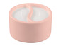 Deux bougies blanches dans un bougeoir rose en forme de yin-yang.