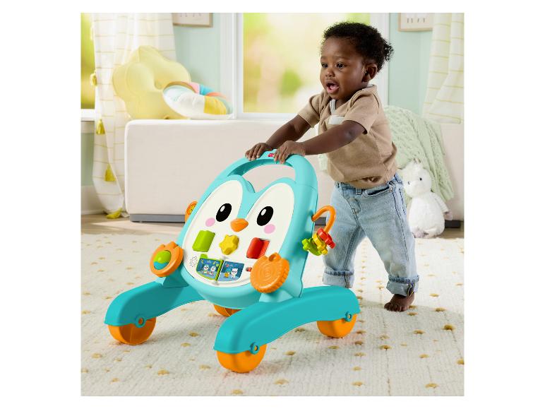 Trotteur Fisher-Price en forme de pingouin avec un enfant apprenant à marcher.