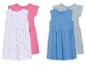 Deux robes pour filles : une à imprimés toucans et une bleue unie.