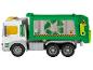 Un camion à ordures vert en plastique avec un symbole de recyclage.