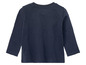 Un t-shirt à manches longues bleu marine pour bébé.