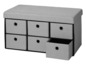 Banc de rangement gris avec six tiroirs.