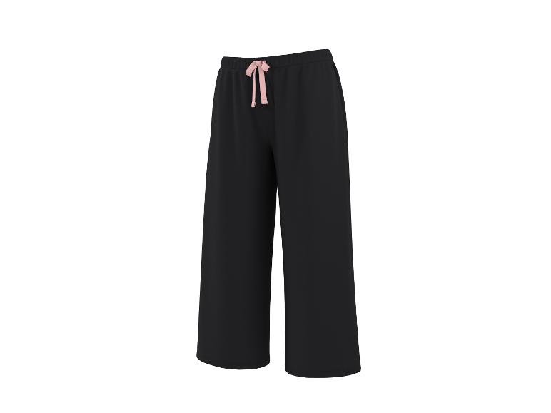 Pantalon large noir pour femme avec cordon de serrage rose à la taille.
