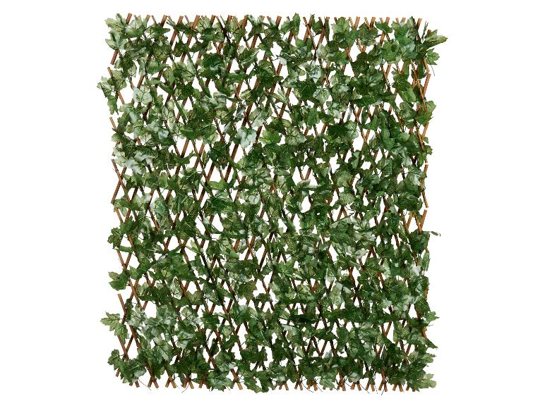 Clôture en bois extensible avec des feuilles vertes artificielles.