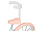 Un vélo rose pour enfant avec une barre de sécurité.