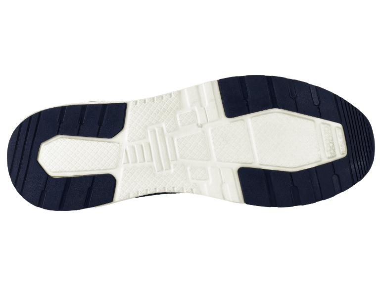 Semelle de chaussure de sport avec un motif blanc et bleu foncé